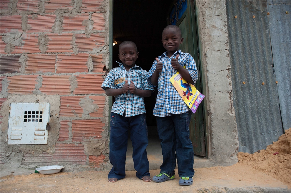 Both represent  many children displaced by war. They`re happy celebrating xmas. 