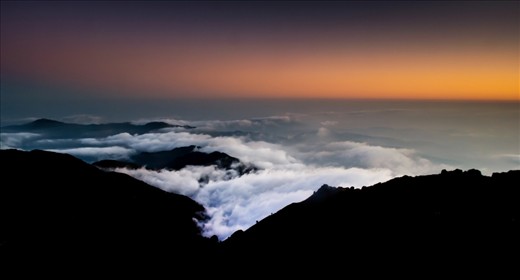 The Himalaya is also known as the wall as it blocks the cold winds from the North and keeps the clouds on its other side providing a great climate and a diverse ecological habitat. The photo shows how the high ranges of the Himalayas don’t allow the clouds to pass. Sandakhphu, West Bengal, India  