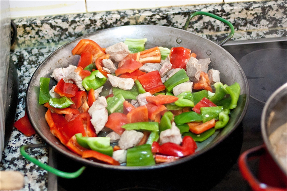 Sauteing Peppers and Rabbit 