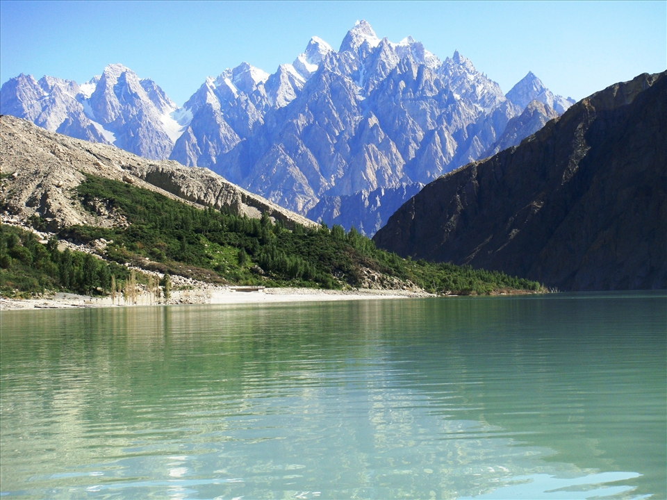 Passu Cone also known Cathedral peak in the background of Attabad Lake formed by the landslide in Hunza vally on Jan 4th, 2010, five villages submerged in this lake in upstream in Gojal valley and still there is no access to the down cities of Pakistan, boats are operating in summer but in winter it freezes and the valley become completely landlocked.