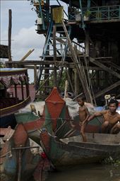 A father and son undock their boat from their house in Kompong Phluk. Cambodia.: by spencerdrake, Views[326]