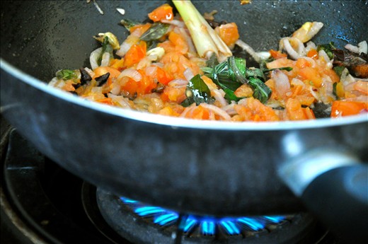 Sauteeing the tomatoes and onions until soft is important for the curry