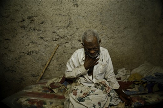 Edmond lives alone in a mud hut that gets destroyed every rainy season.