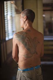 This man displays his tattoo , a reminder of what his life was before he got leprosy and before he become a part of this community in Culion. He says, 