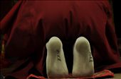 A monk in the western Qing Hai prays in worn Nike socks.: by spillthebeins, Views[589]