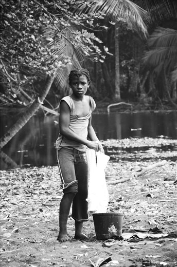 A beautiful girl are cleaning clothes in the beach