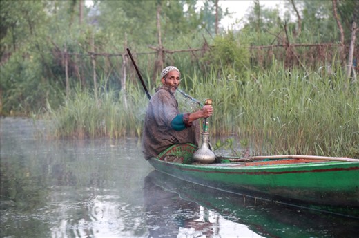 After exchange the goods in the morning market the old man is relaxing himself by take a ‘Baraku’ that is the most popular tobacco in Kashmir.