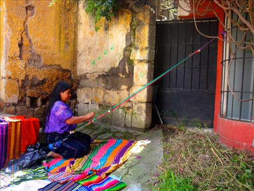 A woman sets up shop outside a school in Xela, Guatemala.