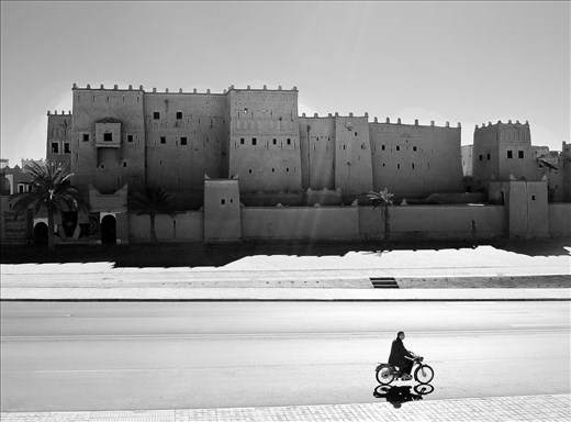 Late afternoon light shines on a kasbah in a rural area of Morocco