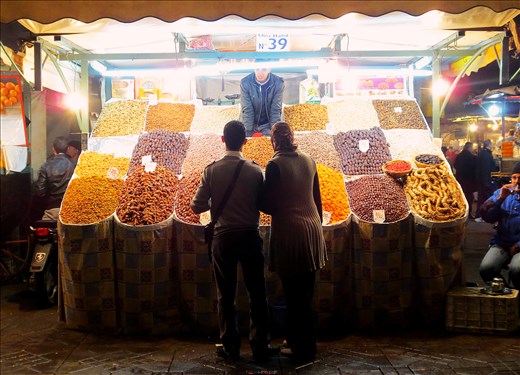 A couple browses the night market in Marrakesh.