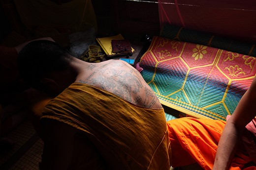 Sank Yant Tatto on the back of a monk. This young monk actually was a boxer before he become a monk. His tatto represent his believe to power and also protection to his family