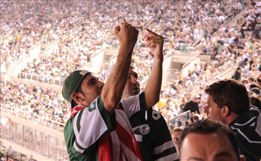 I was at my 1st NFL game with my cousins and these fans of rival teams were constantly going at each other. It took the focus out of the game for me and became about the fans! It was such a great experience and thought that this image summed up both sides of the argument with one gesture! I like the rawness and realness of this image.