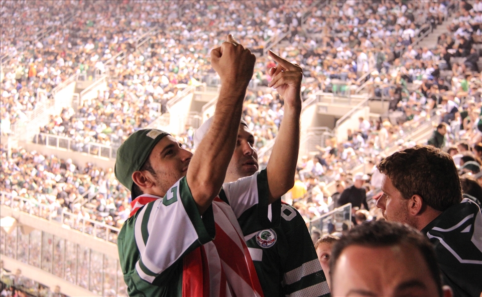 I was at my 1st NFL game with my cousins and these fans of rival teams were constantly going at each other. It took the focus out of the game for me and became about the fans! It was such a great experience and thought that this image summed up both sides of the argument with one gesture! I like the rawness and realness of this image.