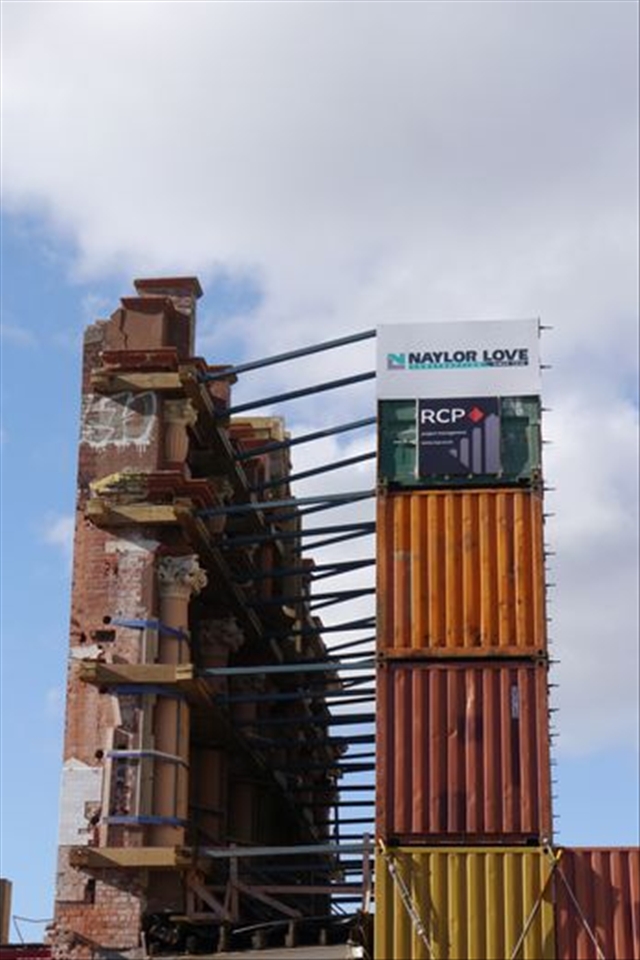 The remaining fascade of the Isaac Royal Theatre which is held by those large containers – to me a desperate effort to keep it standing until they rebuild the backbone of the building. 