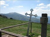 A few steps from the top of Col de Lepoeder, in the heights of the Spanish Pyrenees, a cross acting as route marker points your way forward to Santiago de Compostela, now roughly 775 kilometers away.  After this, just for today, it’s all downhill from here.: by stejomi, Views[993]