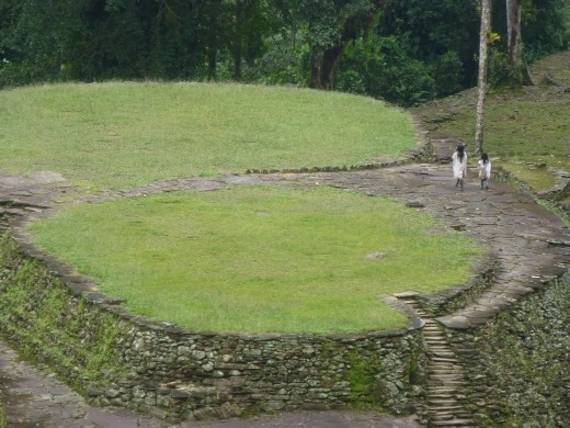 Two corgis going for a stroll.