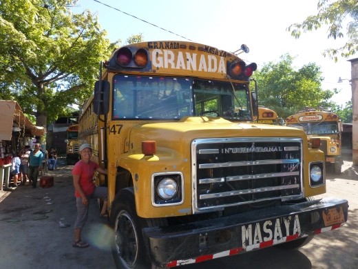 Emma going back to school on a chicken bus.