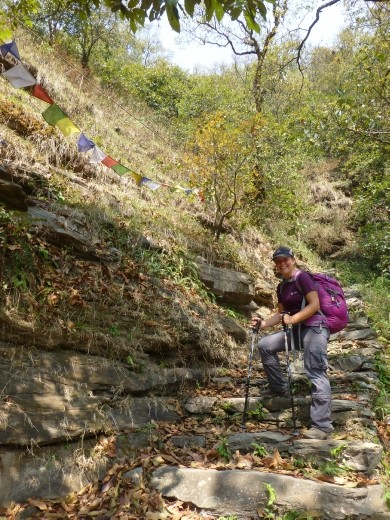 Emma completes the final steps into Phedi, the end of a brilliant trek.