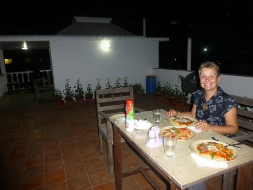 Emma enjoying a meal on our private roof-top terrac at hotel Gandhara, Puri.