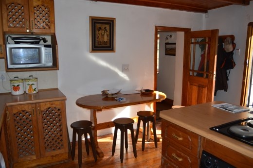 We took out 2 big fridges from this space to be able to put a dining table in the kitchen of the cottage.
