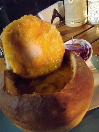 Pork and bean soup in a bun.