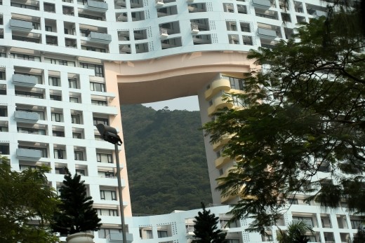 This building lies between the land and the water, the hole was integral to the build as local chinese beliefs state that a dragon has to be able to reach the water otherwise it will be greatly angered.