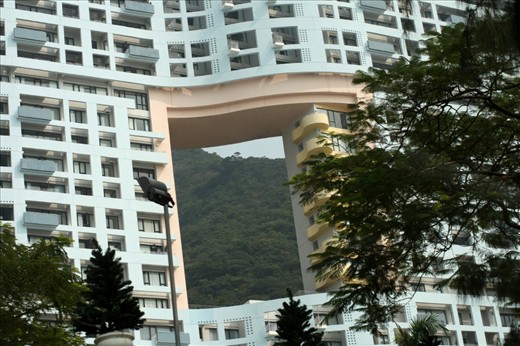 This building has a hole in the middle because it is situated between the land and the water.  Local tradition has it that a dragon needs to reach the water and if its path is blocked would become very angry.