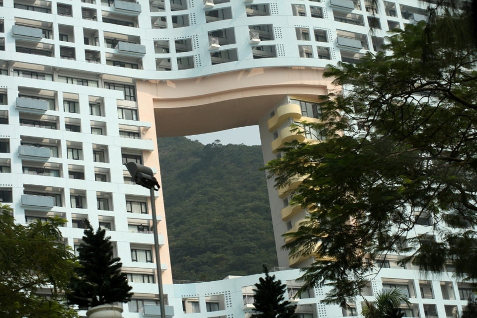 This building has a hole in the middle because it is situated between the land and the water.  Local tradition has it that a dragon needs to reach the water and if its path is blocked would become very angry.