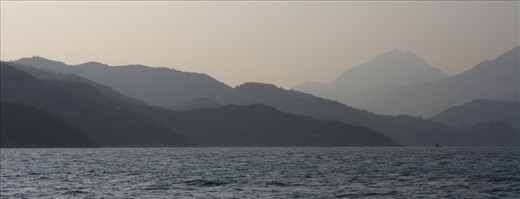 The murky hills lay testament to the air pollution in the area as the daylight is scattered.