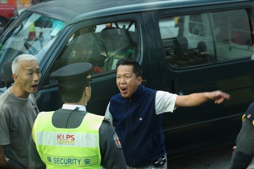 Two men having an altercation before the police intervene.