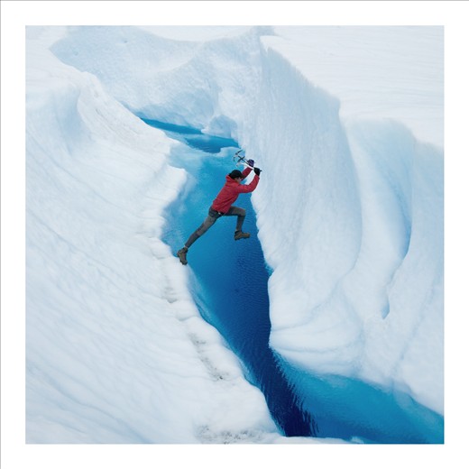 Our guide leaps over a glacial stream hoping for the best. Puerto Montt glacier