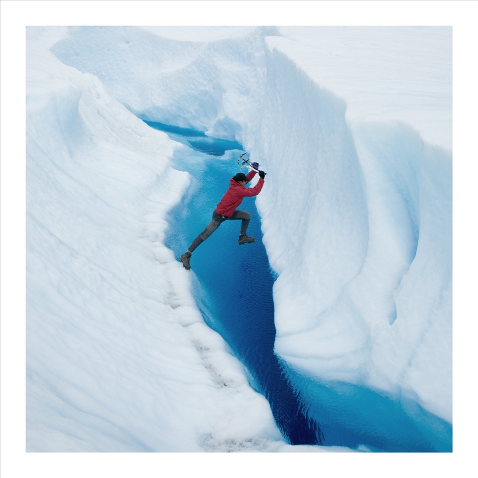 Our guide leaps over a glacial stream hoping for the best. Puerto Montt glacier