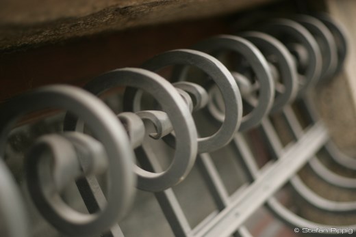 Grossing the street and taking a shot of the cellar window at the Music School.