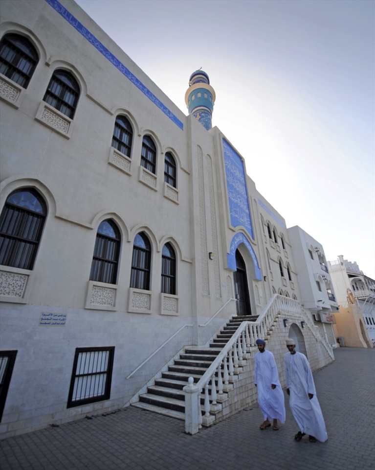 Muscat - Local Omani men take ime out to go to pray.