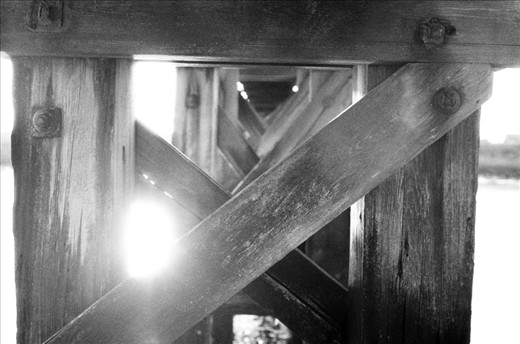 This photo I wanted to show the grain in the wood compared with the grain in the photo.  luckily I got the lens flare I wanted through the beams.