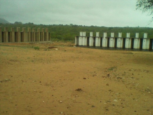 The Facilities: Pit Latrines. On the left are the pit latrines, which we also used as bathrooms. As they had been recently built we were the first to use them.  On the right are the older latrines which were no longer in use. Pit Latrines are used in this area, as in many other rural areas in Zimbabwe.