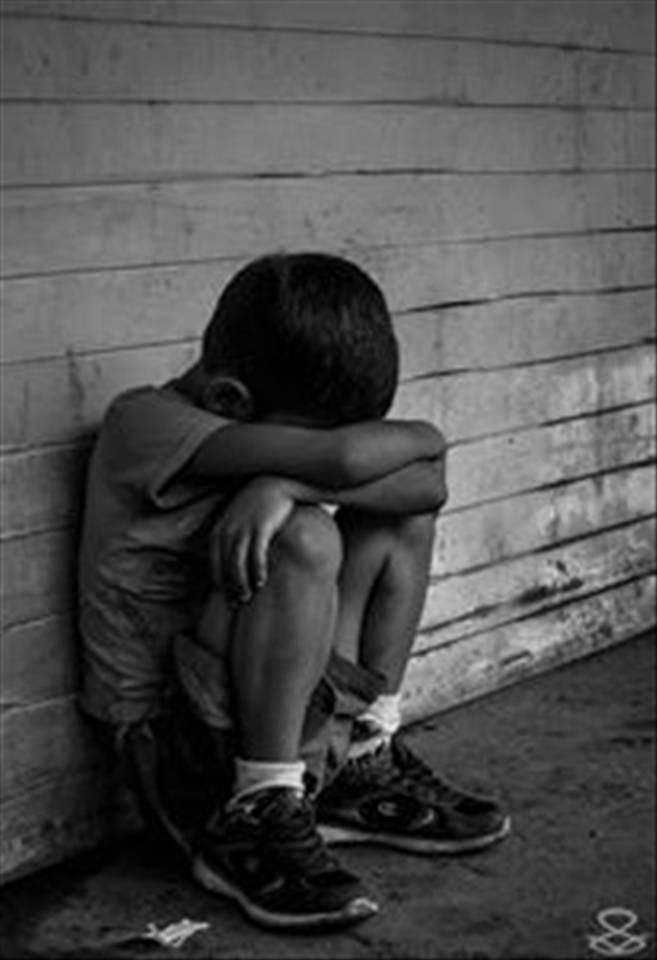 hopeless, alone, sitting in the floor outside of his house.
location: ilegal territory invasion 