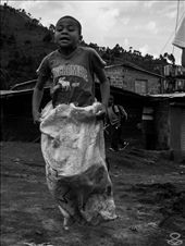 pure happiness, shown by a kid jumping around, enyoing the small things life give them.
location: ilegal territory invasion 