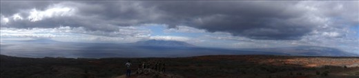 This one of the best experiences I had ever had. Being in a environmental program, getting a chance to go to this island Kaho'olawe and seeing this view. Using panorama you can see Moloka'i on the far left and Maui form the middle to the right with my friends standing and enjoying the view. It was so beautiful, we didn't want to leave.