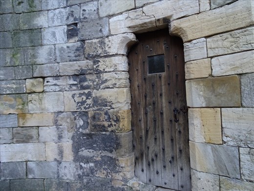 Teeny tiny door in castle ruins