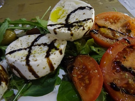 Our first food in Florence at Mercato Centrale. Mozzarella, olives, pomodoro and salad greens drizzled with olio and balsamico