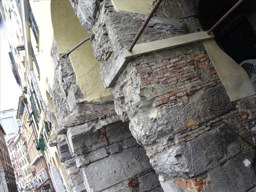 Old and worn old port buildings in Genoa