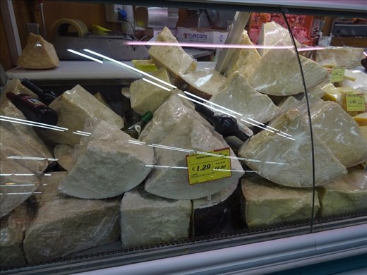 Supermarket cheese section.
Wheels and wheels