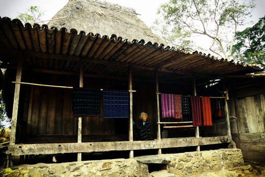 Old Lady waiting for tourists to come and buy Tenun Ikat.