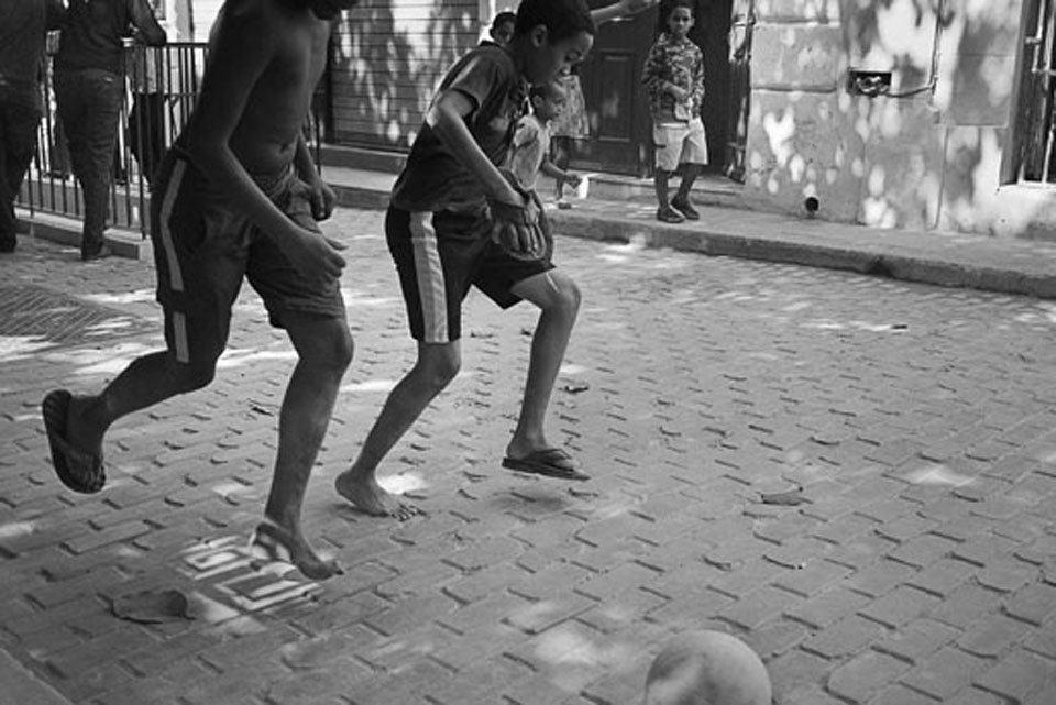 In the streets of Old Havana, young boys engage in a game of football. With little but their bare feet and an old ball, a simple game becomes an afternoon delight. 