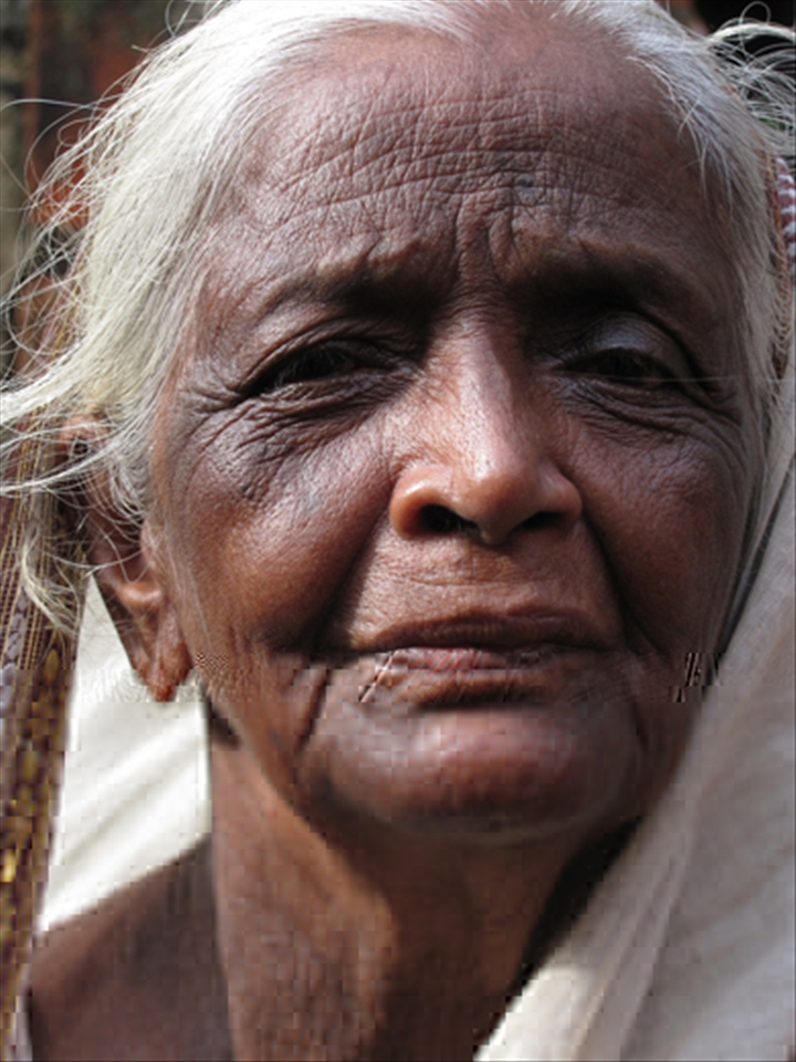 An old woman, who was once an artisan, now enjoys retirement. Kolkata, India.