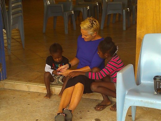 Entertaining the local kids while Court taking place on Badu Island, playing marbles and I phone pictures!