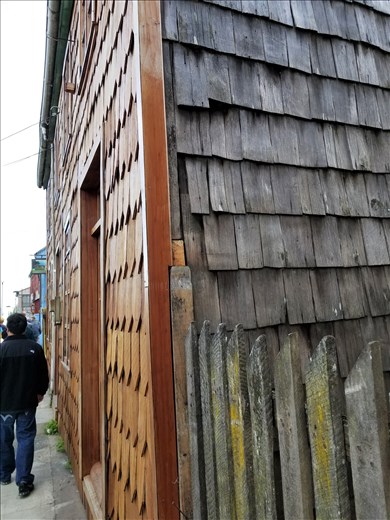 In order to look wealthier than they are, they use the decorative shingles on the front of their houses as shown here.