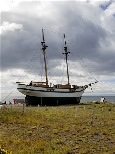 Another ship near Magellan's and Darwin's ships.