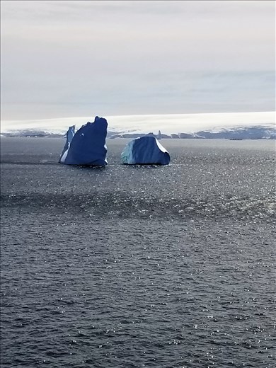 This is actually all one iceberg. The middle is just below water, which is why they're so dangerous.